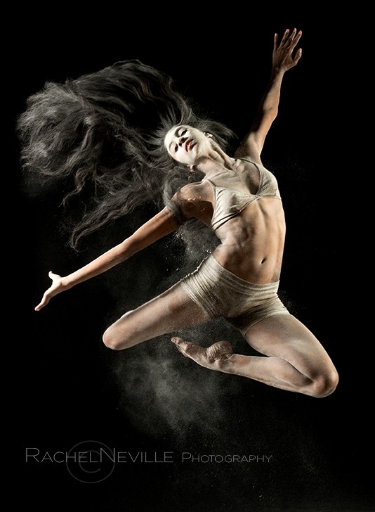 dancer jumping in flour by new york dance photographer rachel neville