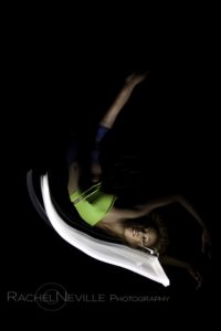lying down dancer legs in air crossed photo by Rachel Neville