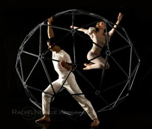 nyc dance photographer rachel neville male dancer and female dancer with jungle gym black background