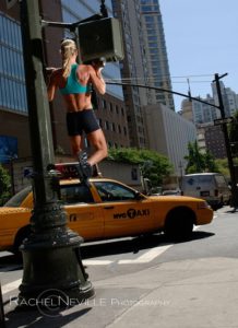 chin ups on nyc light post stoplight fitness photo women hangs from street light