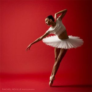 NYC dance photographer Rachel Neville classical ballet clean lines red background