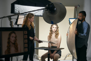 Behind the scenes shot of Madeline Glinski getting her headshot taken by Rachel Neville